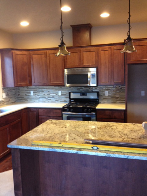 Contemporary Kitchen: Granite with Stained Cabinets
